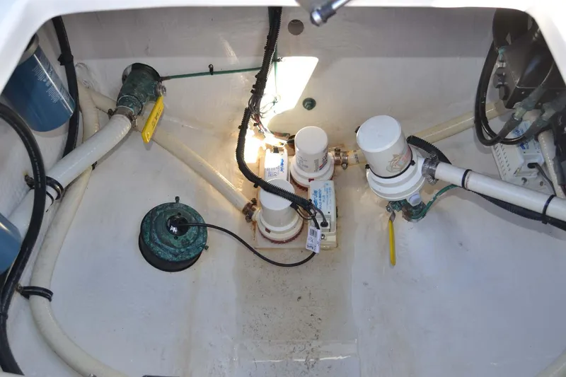 Slide: The Image of 2012 Jupiter 34 FS boat bilge area with pumps and hoses. - 31