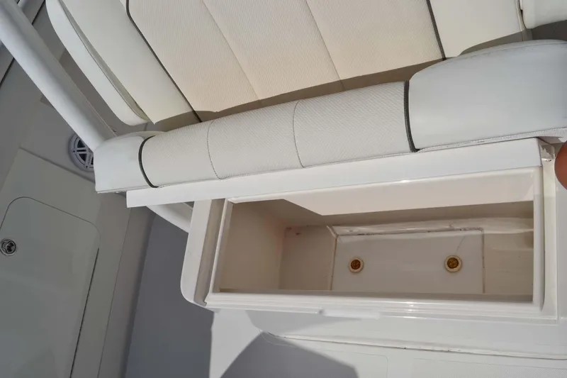 Slide: The Image of 2012 Jupiter 34 FS boat seat with storage compartment open. - 32