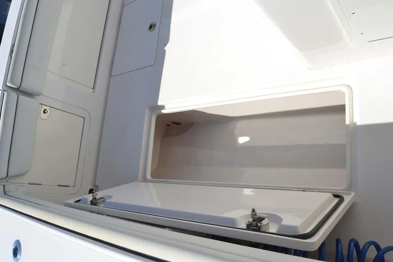 Slide: The Image of Open storage compartment on 2012 Jupiter 34 FS boat deck. - 34