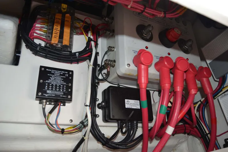 Slide: The Image of Electrical wiring and components inside a 2012 Jupiter 34 FS boat. - 36