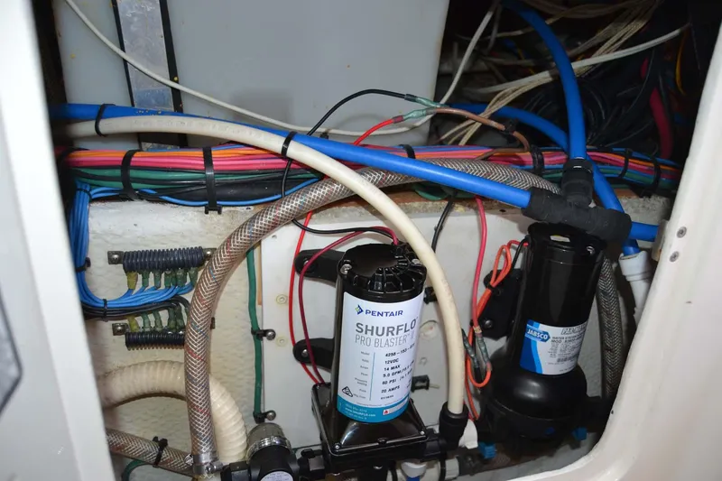 Slide: The Image of Boat wiring and plumbing system in a 2012 Jupiter 34 FS model. - 38