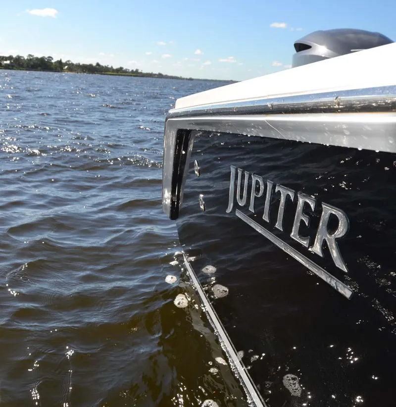 Slide: The Image of 2012 Jupiter 34 FS boat on water, side view with logo. - 39