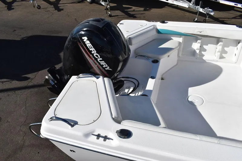 Slide: The Image of 2016 Pro-Line 20 Express boat with Mercury outboard motor, spacious deck layout. - 11