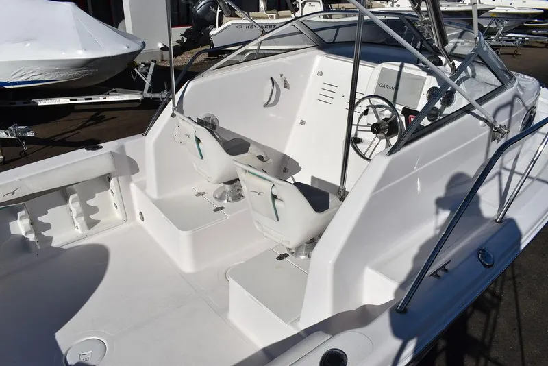 Slide: The Image of 2016 Pro-Line 20 Express boat interior with dual seats and steering wheel. - 13