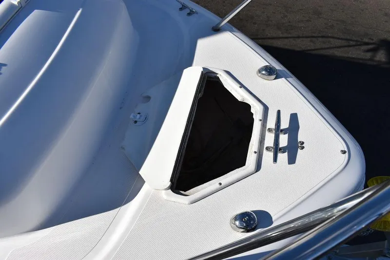 Slide: The Image of 2016 Pro-Line 20 Express boat deck with open hatch and stainless steel fittings. - 17