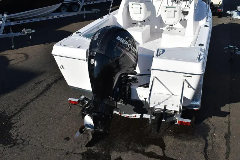 Slide: The Image of 2016 Pro-Line 20 Express boat with Mercury outboard motor, rear view. - 22
