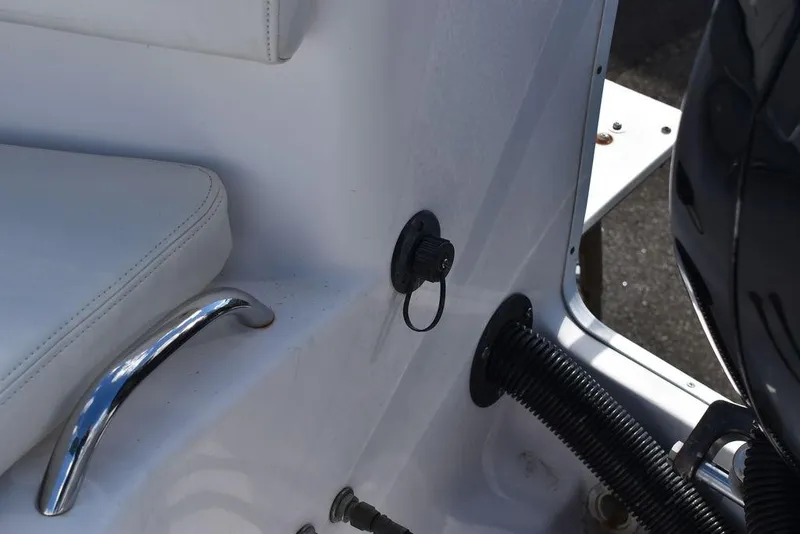 Slide: The Image of 2016 Pro-Line 20 Express boat interior with seating and chrome handle. - 28
