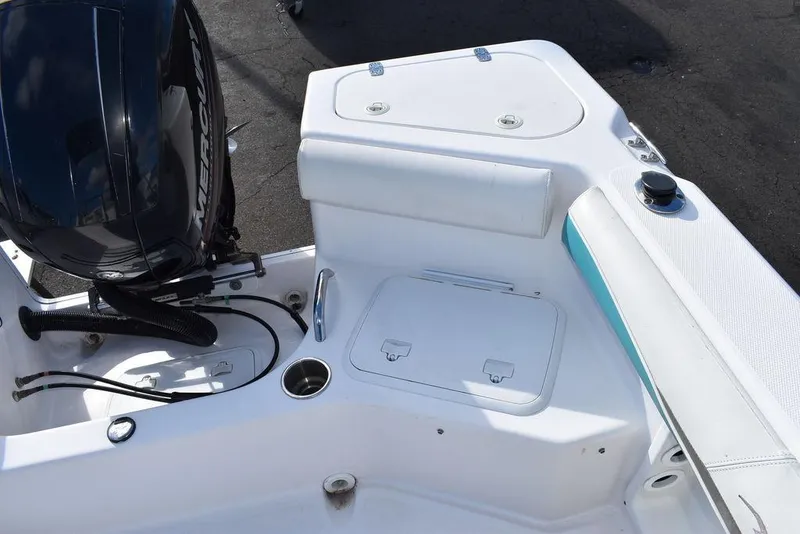 Slide: The Image of 2016 Pro-Line 20 Express boat interior with engine and storage compartments. - 29