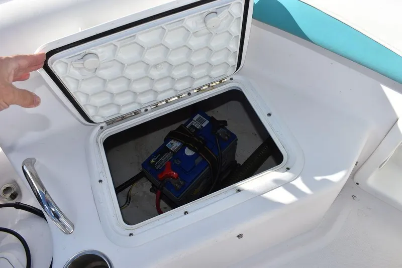 Slide: The Image of 2016 Pro-Line 20 Express boat battery compartment with open hatch. - 30