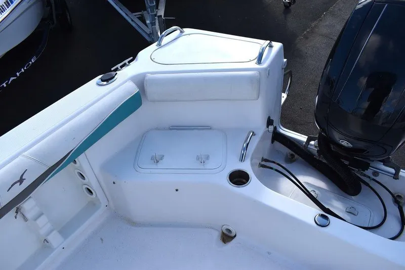 Slide: The Image of 2016 Pro-Line 20 Express boat interior with motor and storage compartments. - 31