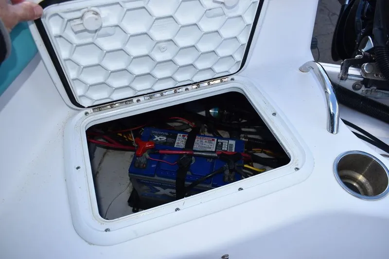 Slide: The Image of 2016 Pro-Line 20 Express boat battery compartment with open hatch. - 32