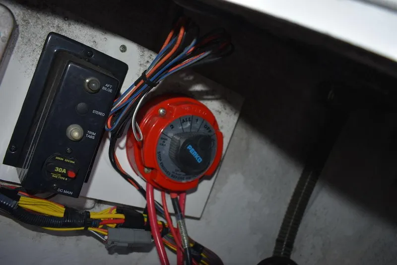Slide: The Image of 2016 Pro-Line 20 Express boat electrical panel with wiring and switches. - 33