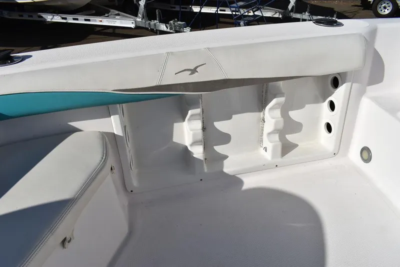 Slide: The Image of 2016 Pro-Line 20 Express boat interior with storage compartments and seating. - 34