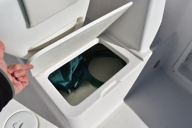Slide: The Image of Open storage compartment on 2016 Pro-Line 20 Express boat. - 38