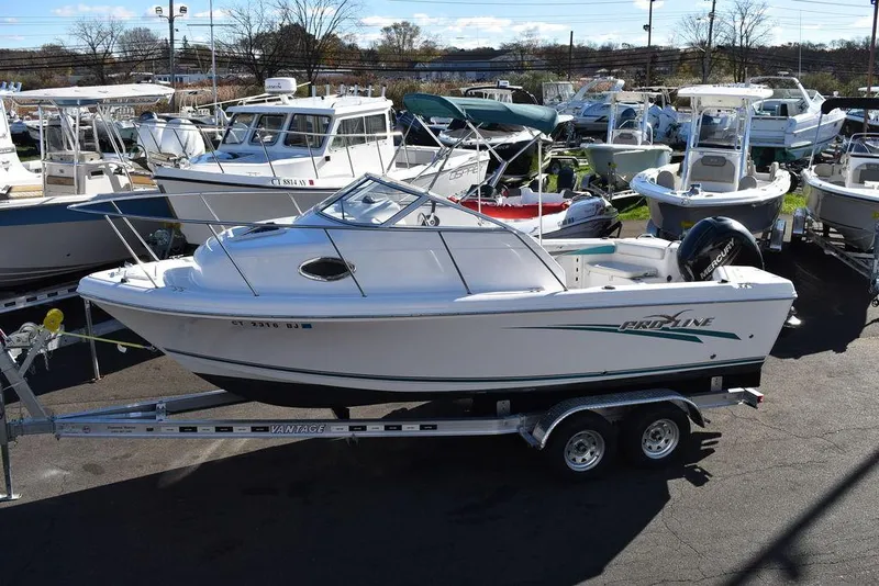Slide: The Image of 2016 Pro-Line 20 Express boat on trailer in marina. - 4