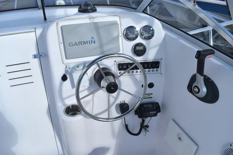 Slide: The Image of 2016 Pro-Line 20 Express boat dashboard with Garmin navigation system and controls. - 41