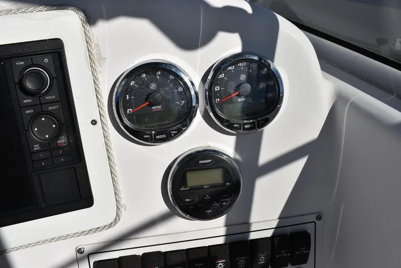 Slide: The Image of Dashboard of 2016 Pro-Line 20 Express boat with gauges and controls. - 48