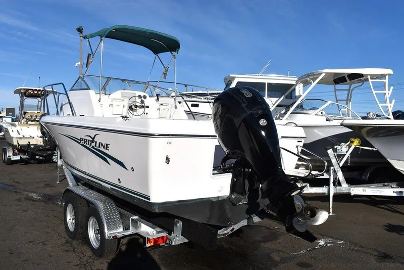 Slide: The Image of 2016 Pro-Line 20 Express boat on trailer, featuring outboard motor and canopy. - 5
