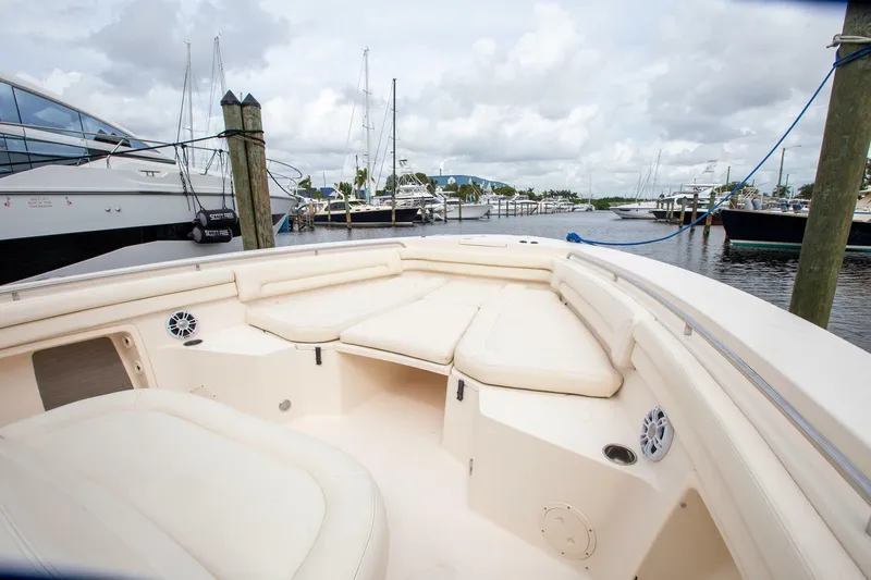 Slide: The Image of 2016 Grady-White 376 Canyon boat with spacious seating at marina. - 11