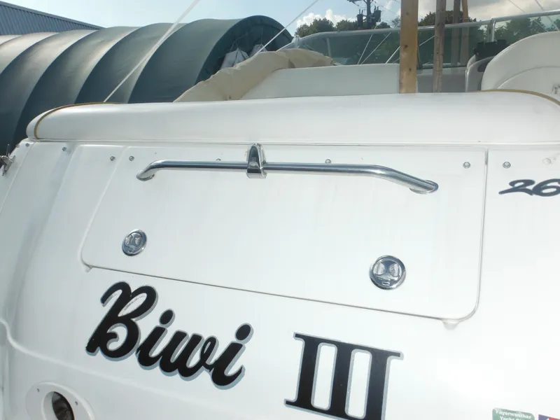 Slide: The Image of 2002 Sea Ray 260 Sundancer boat with "Biwi III" name on the stern. - 17