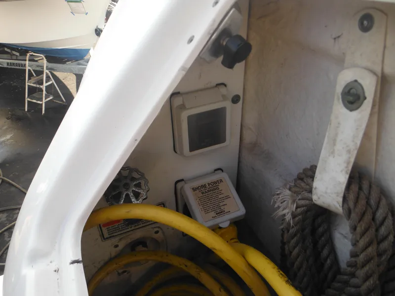 Slide: The Image of Close-up of 2002 Sea Ray 260 Sundancer boat's electrical panel and yellow shore power cord. - 19