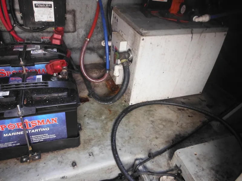 Slide: The Image of Engine compartment of 2002 Sea Ray 260 Sundancer with batteries and wiring. - 22