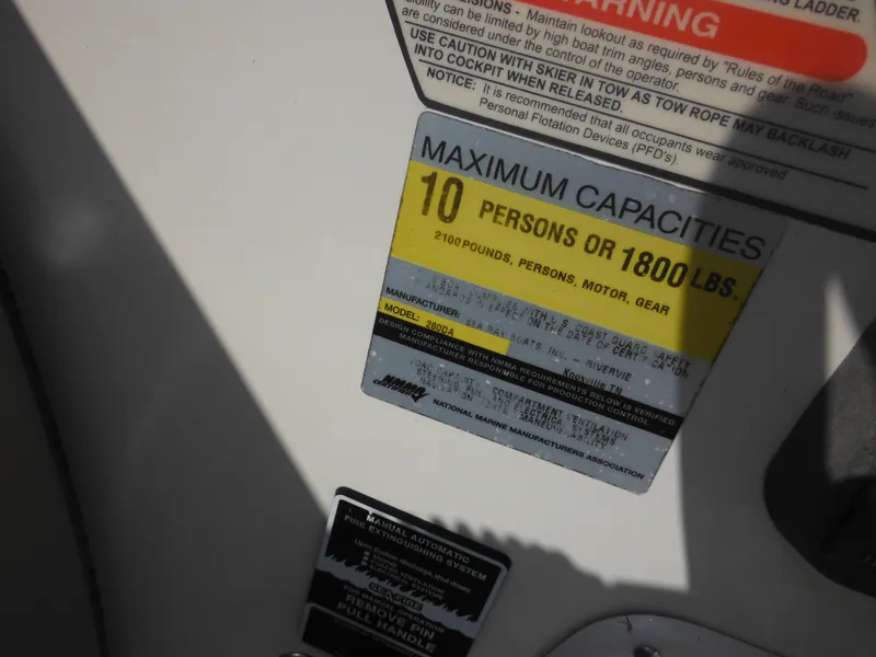 Slide: The Image of Capacity label on 2002 Sea Ray 260 Sundancer, max 10 people or 1800 lbs. - 33