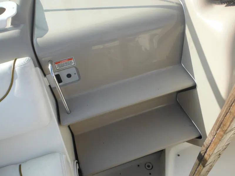 Slide: The Image of 2002 Sea Ray 260 Sundancer boat interior steps, beige and white design. - 40
