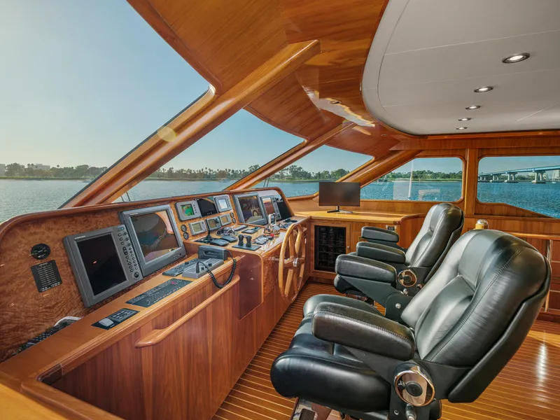 Slide: The Image of Luxurious 2011 President Sterling yacht helm with leather seats and advanced navigation systems. - 23