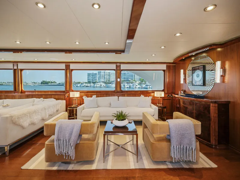 Slide: The Image of Luxurious yacht interior with elegant seating, modern decor, and large windows overlooking the ocean. - 33