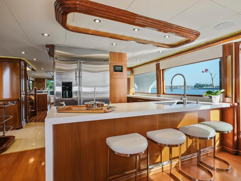 Slide: The Image of Luxurious yacht kitchen interior with modern design, featuring wood accents and stainless steel appliances. - 42