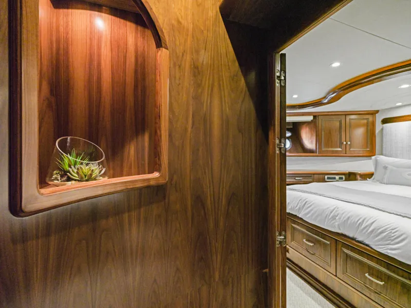 Slide: The Image of Luxurious 2011 President Sterling yacht interior with wood paneling and elegant bedroom. - 47