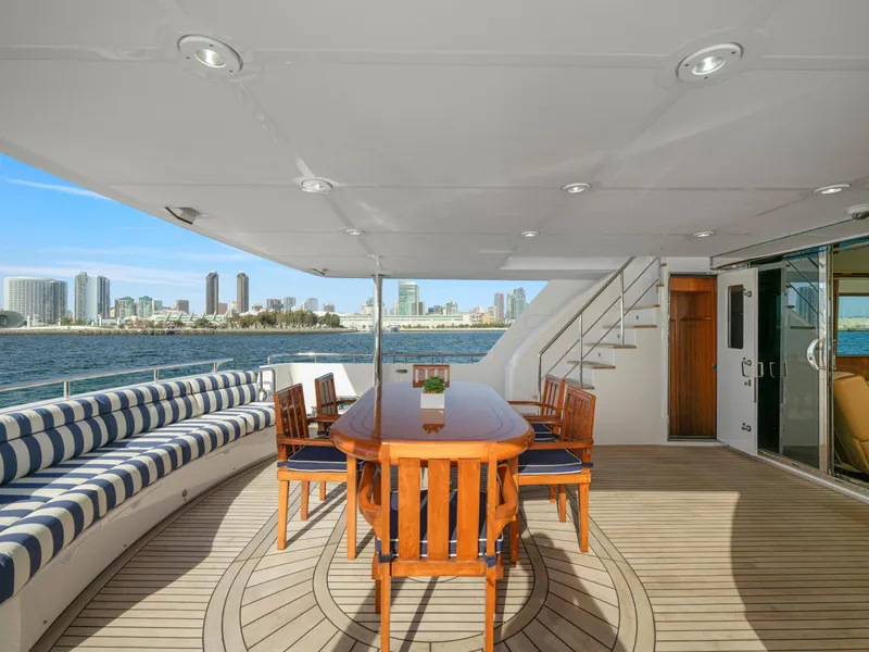 Slide: The Image of Luxurious 2011 President Sterling yacht deck with dining area and city skyline view. - 6