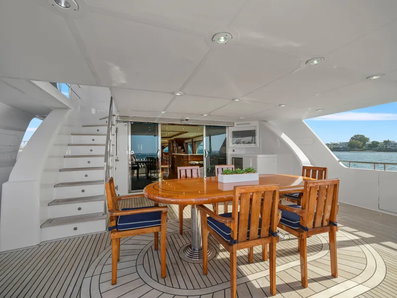 Slide: The Image of Luxurious 2011 President Sterling yacht deck with elegant wooden dining set. - 7