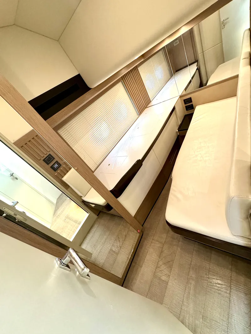 Slide: The Image of Guest StateRoom w/ Custom Office Converts to Bed  - 41
