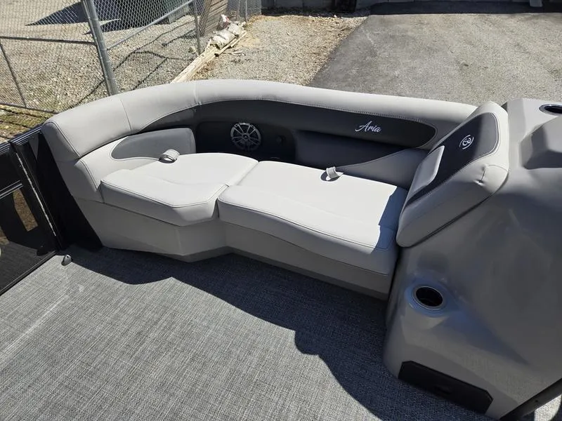 Slide: The Image of 2025 Barletta A22QC boat interior with gray seating and speaker. - 13