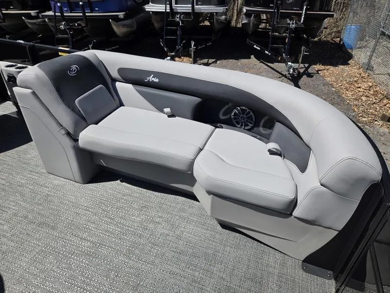 Slide: The Image of 2025 Barletta A22QC boat interior with gray seating and speaker system. - 14