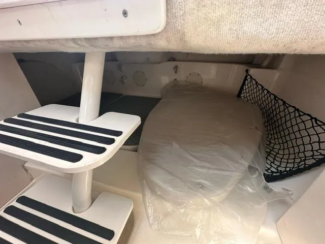 Slide: The Image of Interior cabin of 2003 Trophy 2902 Walkaround boat with steps and storage net. - 11