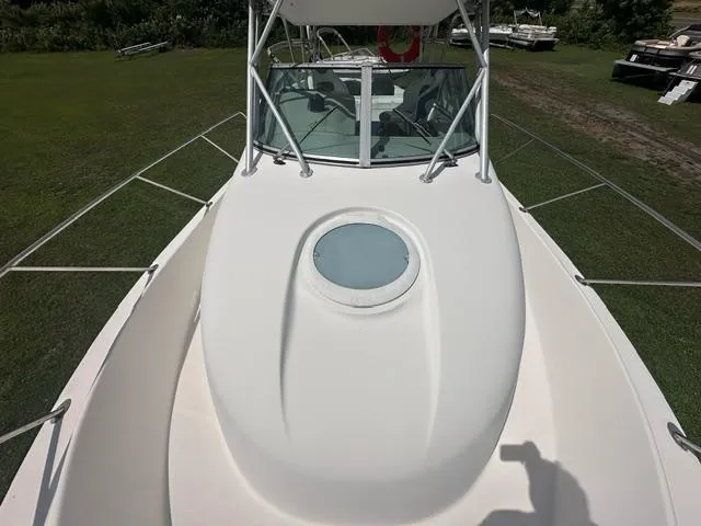 Slide: The Image of 2003 Trophy 2902 Walkaround boat, top view, showcasing deck and windshield. - 14