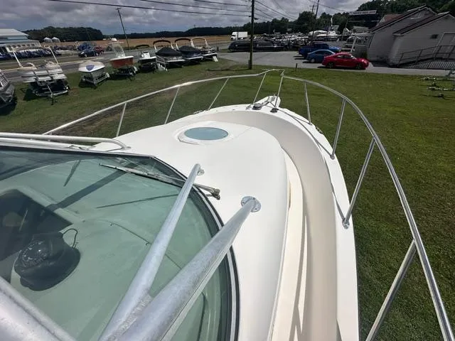 Slide: The Image of 2003 Trophy 2902 Walkaround boat on display at a marina. - 17