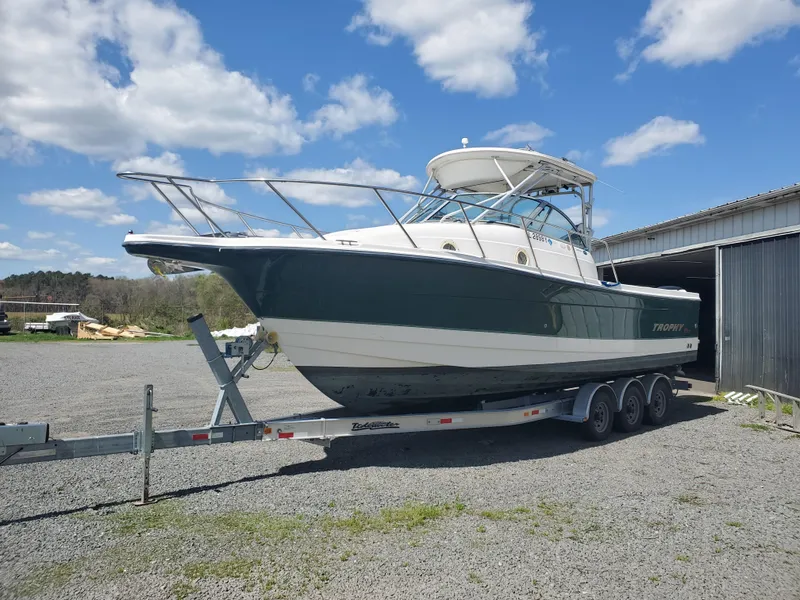 Slide: The Image of 2003 Trophy 2902 Walkaround boat on trailer under blue sky. - 2