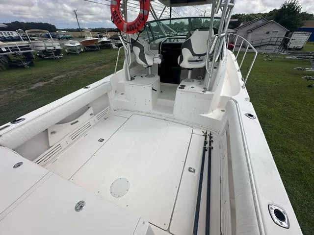 Slide: The Image of 2003 Trophy 2902 Walkaround boat with spacious deck and seating area. - 4