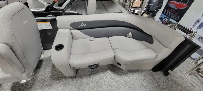 Slide: The Image of 2025 Barletta A20QC boat interior with plush seating and cup holder. - 11