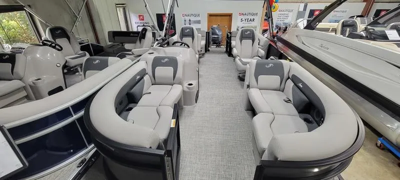 Slide: The Image of 2025 Barletta A20QC pontoon boat interior with luxurious seating and modern design. - 4