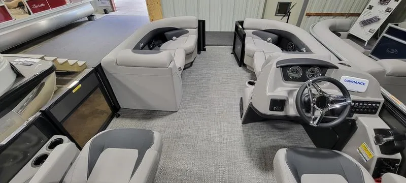 Slide: The Image of Interior of 2025 Barletta A20QC pontoon boat with modern seating and steering console. - 6