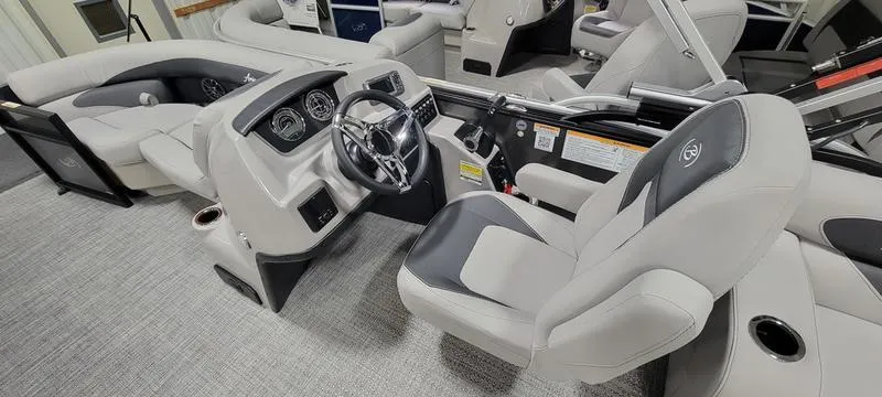Slide: The Image of 2025 Barletta A20QC boat interior with modern steering and seating. - 8