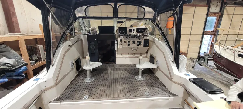 Slide: The Image of 1996 Albemarle 27 Express boat interior with helm and seating area. - 17