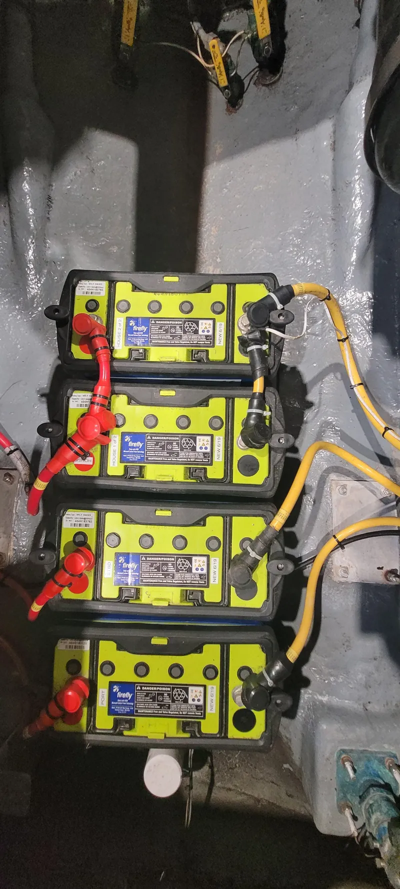 Slide: The Image of Four marine batteries in a 1996 Albemarle 27 Express boat. - 18