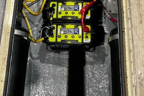 Slide: The Image of Battery compartment of a 1996 Albemarle 27 Express boat with dual batteries and wiring. - 19