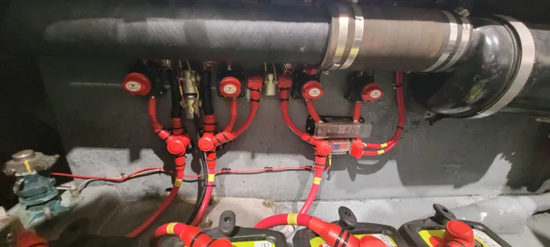 Slide: The Image of Engine compartment of a 1996 Albemarle 27 Express boat with red wiring and components. - 22